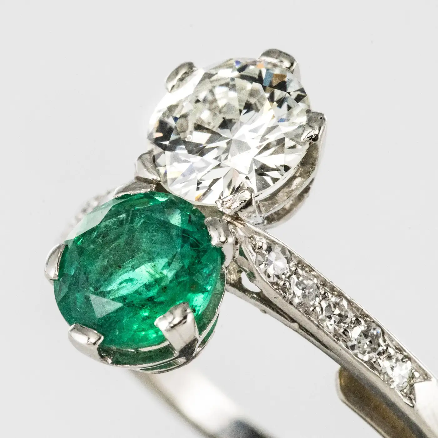 1930s-French-Platinum-Art-Deco-Emerald-Diamond-You-and-Me-Ring-1.webp
