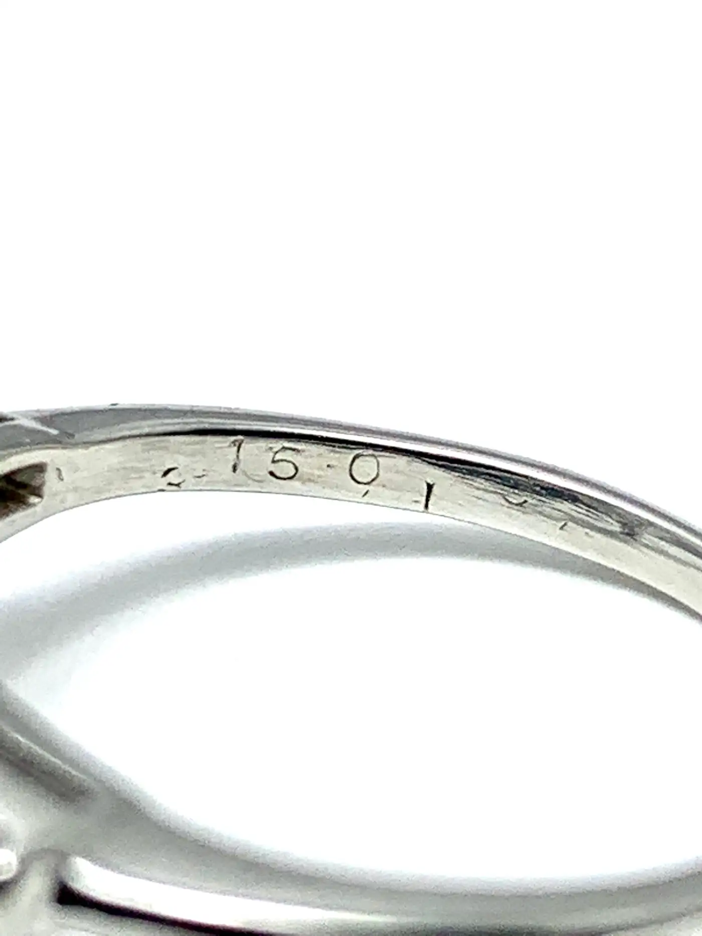 3.14-Carat-D-SI1-Pear-Shape-Diamond-and-Baguette-Diamond-Platinum-Ring-2.webp