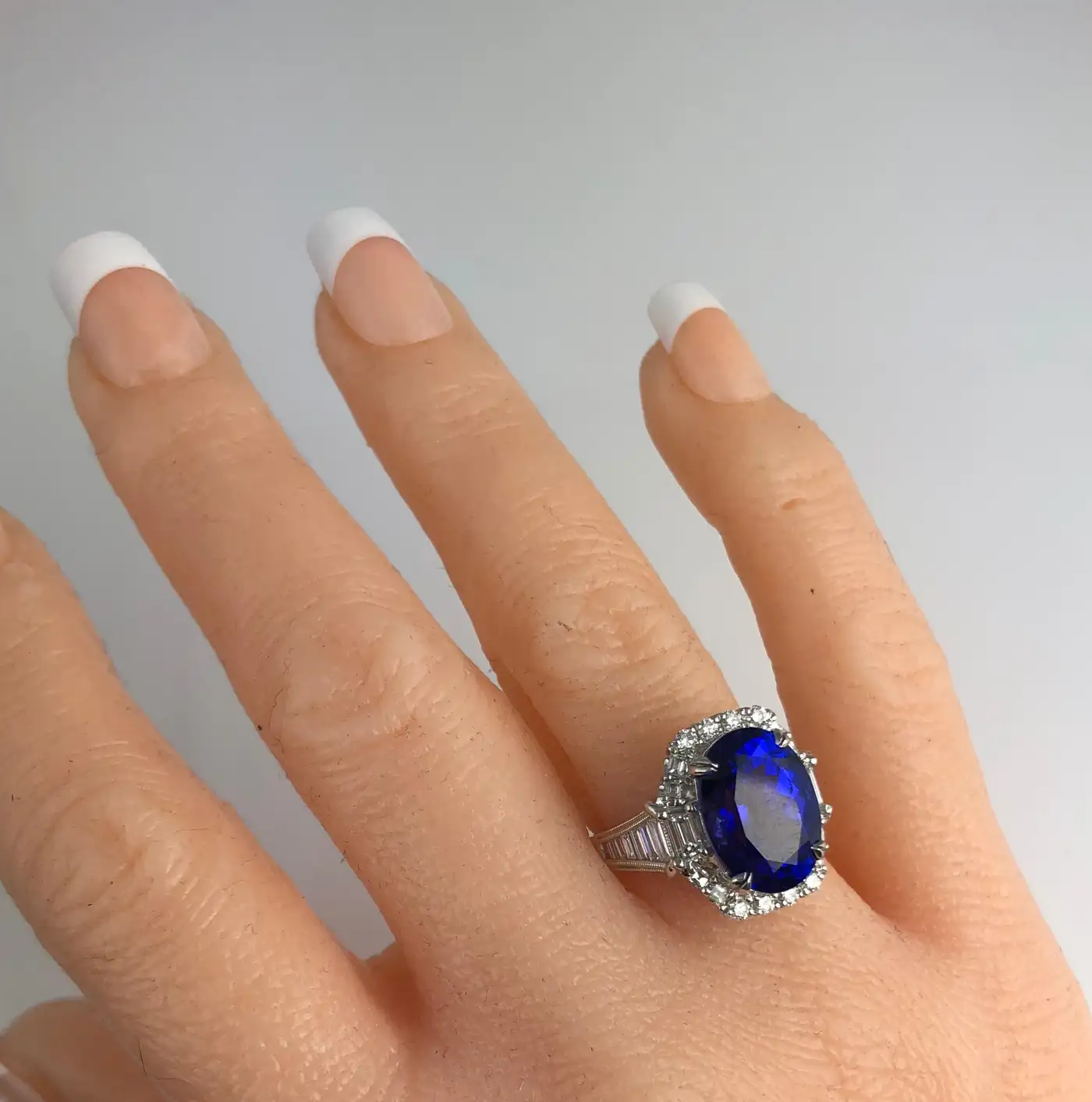 DiamondTown-GIA-Certified-8.30-Carat-Oval-Cut-Bluish-Violet-Tanzanite-Ring-4.webp